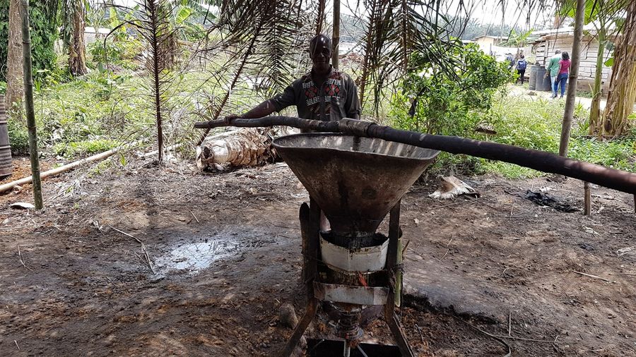 Artisanal oil producer in Uganda (photo credit Claude A. Garcia)